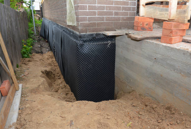 Happy homeowners after waterproofing job in Bowling Green